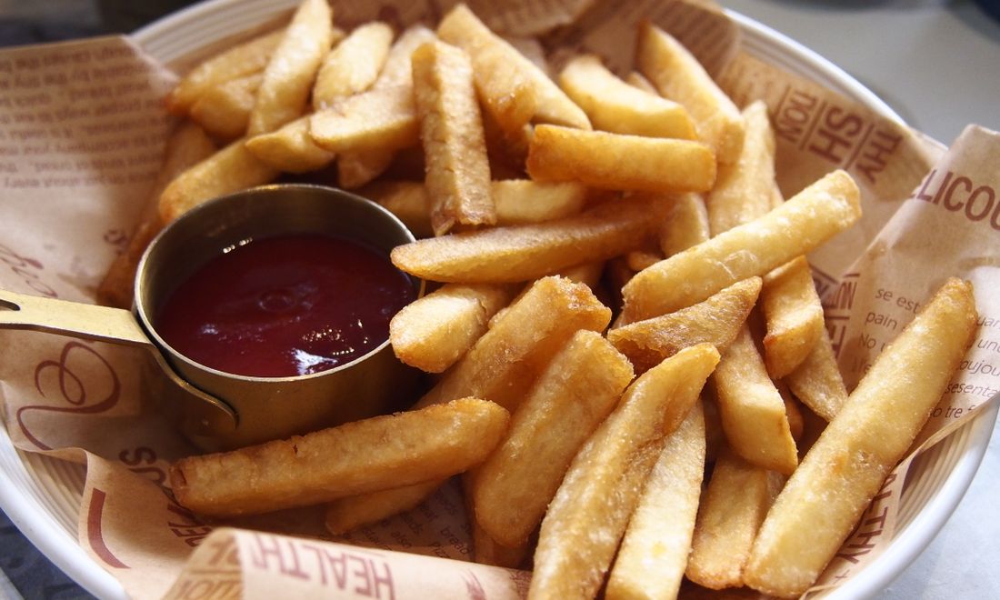 A basket of golden twice-cooked fries.
